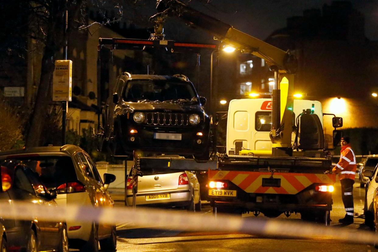 A private contractor removes a Jeep Car at the crime scene in Brooke Road, Hackney: NIGEL HOWARD ©