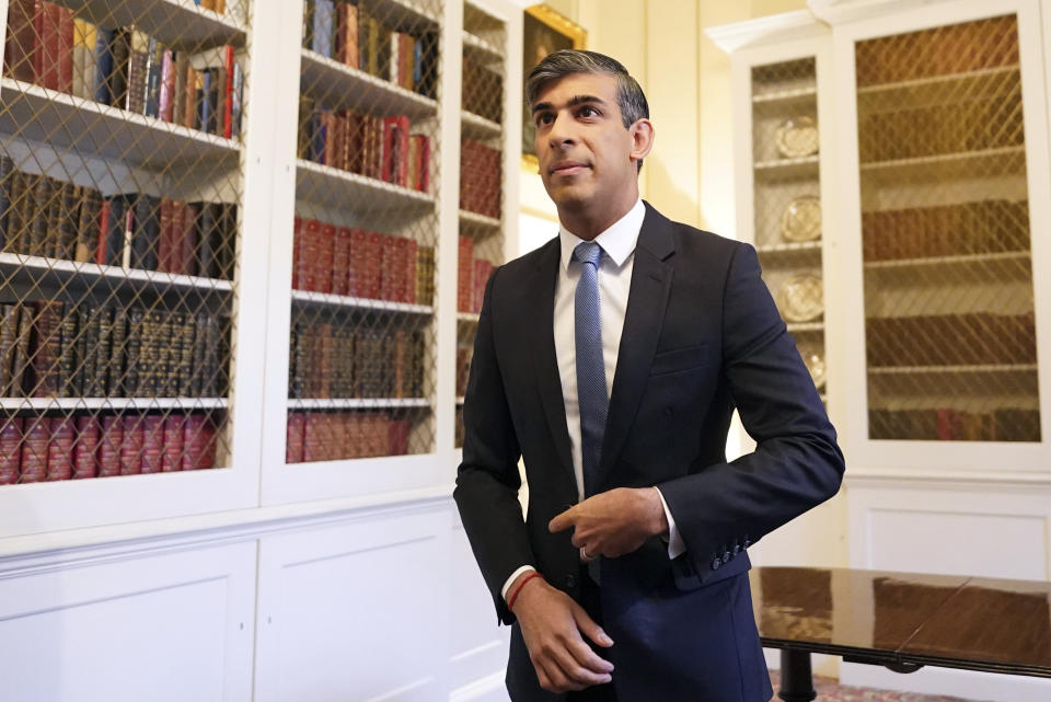 Britain's Prime Minister Rishi Sunak in Downing Street in London Wednesday May 22, 2024, after speaking about the latest inflation figures. Inflation in the U.K. fell sharply to its lowest level in nearly three years in April on the back of big declines in domestic bills, official figures showed Wednesday. (Stefan Rousseau/Pool Photo via AP)