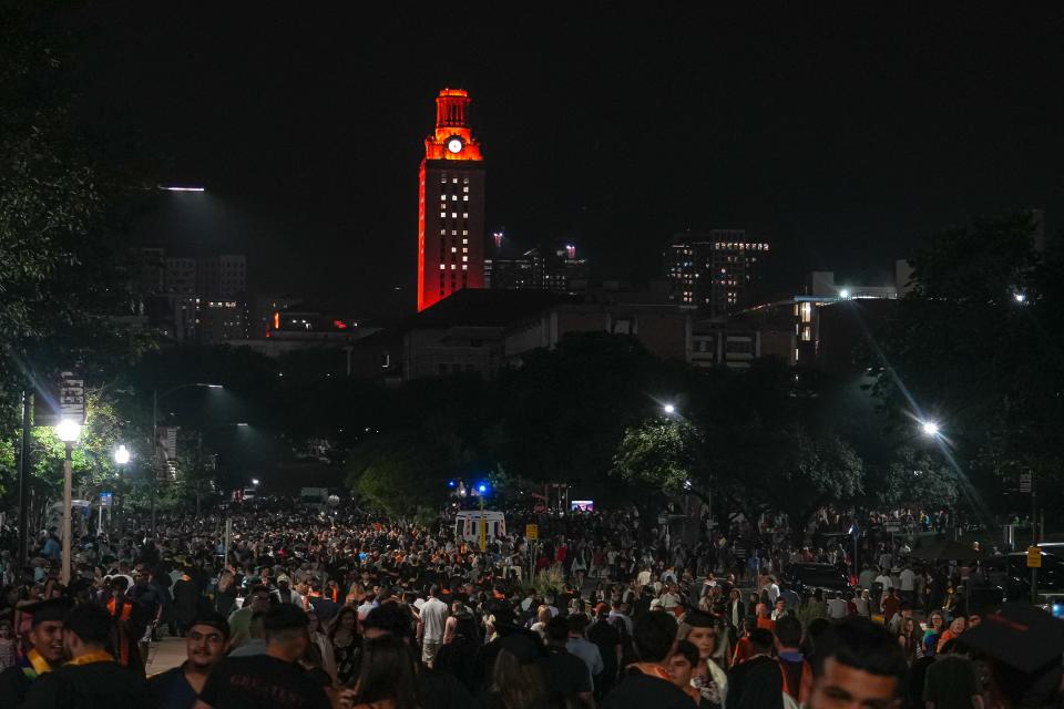 Thousands of graduates and their families fill the streets outside Royal-Memorial Stadium after the UT commencement ceremony Saturday night.