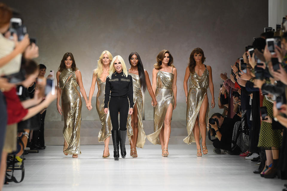 Carla Bruni-Sarkozy, Claudia Schiffer, Donatella Versace, Naomi Campbell, Cindy Crawford, and Helena Christensen walk the runway at the Versace show during Milan Fashion Week Spring/Summer 2018 on Sept. 22, 2017, in Milan, Italy. (Photo: Venturelli/WireImage)