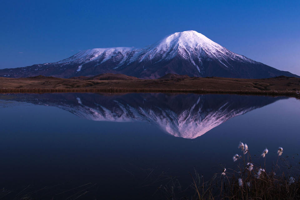 Stunning images capture ‘UFO’ clouds surrounding volcano 