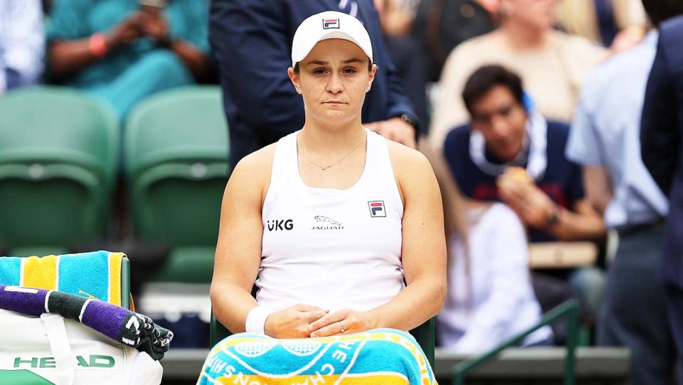 Ash Barty (pictured) sits down between games at Wimbledon.