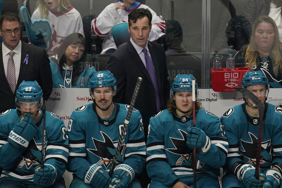 San Jose Sharks coach David Quinn, top, watches during the third period of the team's NHL hockey game against the New York Rangers in San Jose, Calif., Saturday, Nov. 19, 2022. (AP Photo/Jeff Chiu)