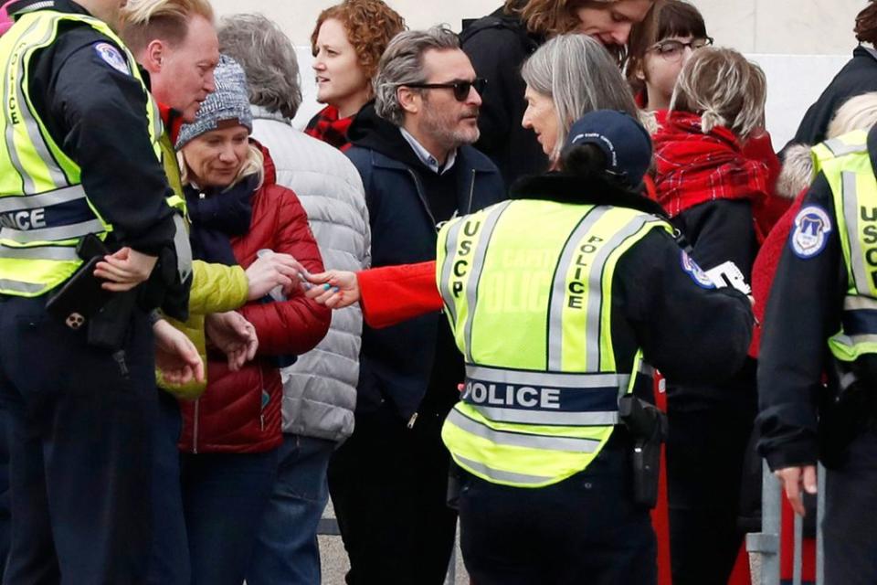 Joaquin Phoenix (center) at Friday's Fire Drill Fridays protest on Capitol Hill in Washington, D.C. | Jacquelyn Martin/AP/Shutterstock