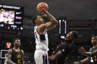 Connecticut's Jordan Hawkins shoots as Grambling State's Terreon Randolph defends in the first half of an NCAA college basketball game, Saturday, Dec. 4, 2021, in Storrs, Conn. (AP Photo/Jessica Hill)