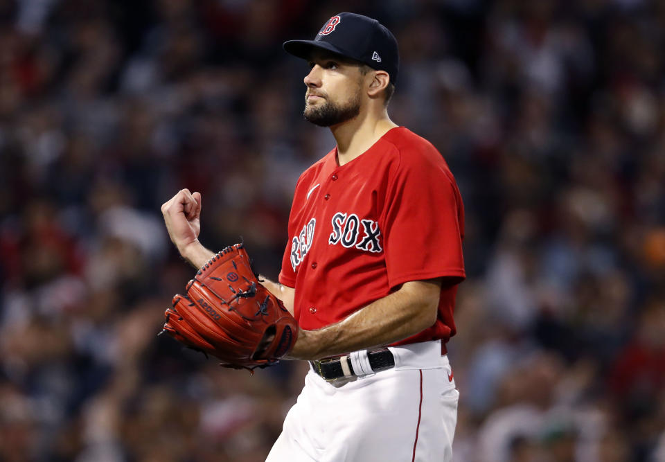 Boston - October 5: Red Sox starting pitcher Nate Eovaldi pounds his glove after striking out the last batter of the top of the first inning. The Boston Red Sox host the New York Yankees in the American League Wild Card Playoff Game at Fenway Park in Boston on Oct. 5, 2021. (Photo by Jim Davis/The Boston Globe via Getty Images)