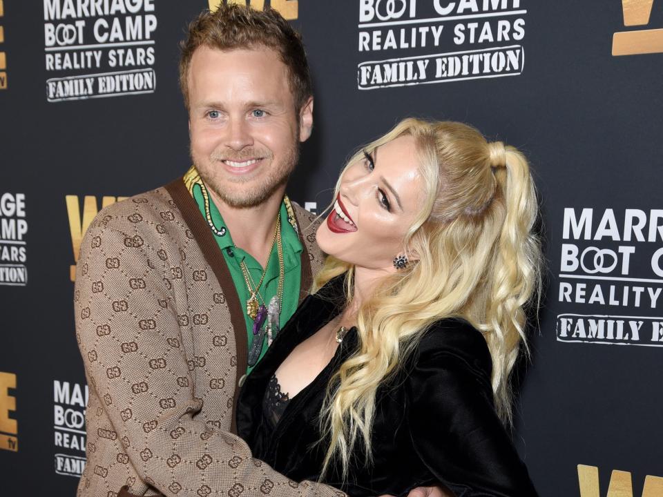 spencer and heidi pratt posing on a marriage boot camp red carpet in 2018