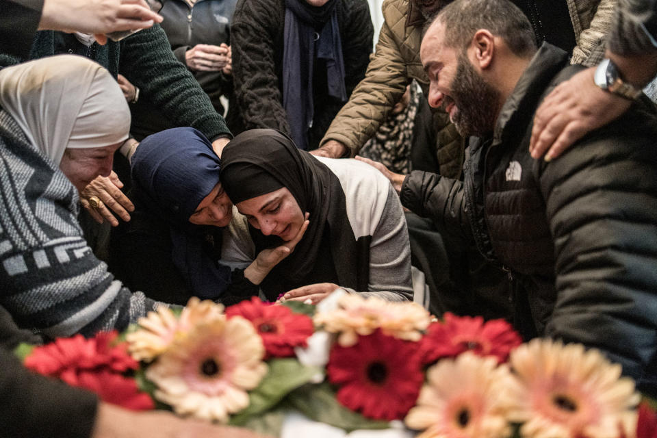 Women console the mother (C) of 17-year-old Palestinian Tawfeek Ajaq, who holds a US citizenship was killed a day earlier in the village of Al-Mazraa Al-Sharqiya in the West Bank, before his funeral procession on Jan. 20, 2024. (Marco Longari / AFP via Getty Images)