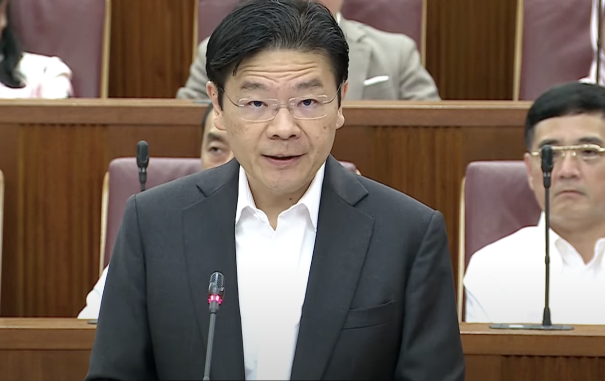 Deputy Prime Minister and Finance Minister Lawrence Wong delivering the Singapore Budget 2024 in Parliament, illustrating a story on Budget announcements including more CDC vouchers.