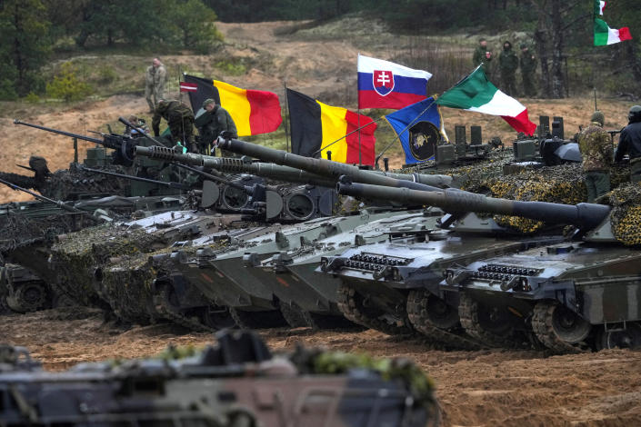 Tanks and military vehicles of NATO Enhanced Forward Presence battle groups stand together before live fire exercise, during Iron Spear 2022 military drill in Adazi, Latvia November 15, 2022. REUTERS/Ints Kalnins