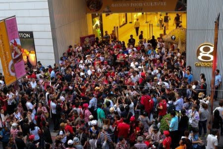 Protesters gather in front of a department store to mark the anniversary of a deadly army crackdown on an anti-government protest in 2010, in central Bangkok, Thailand May 19, 2018. REUTERS/Panu Wongcha-um