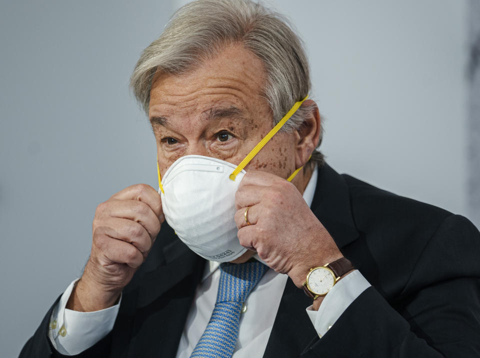 United Nations Secretary General Antonio Guterres wears a face mask at the end of a press conference in Rome, Friday, Oct. 29, 2021. Guterres blamed geo-political divides for hampering a global vaccination plan to reach "everyone, everywhere" to fight the COVID-19 pandemic. (AP Photo/Domenico Stinellis)