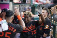 Baltimore Orioles' Domingo Leyba (75) celebrates in the dugout with teammates after hitting a home run during the second inning of a baseball game against the Los Angeles Angels Friday, July 2, 2021, in Anaheim. (AP Photo/Ashley Landis)