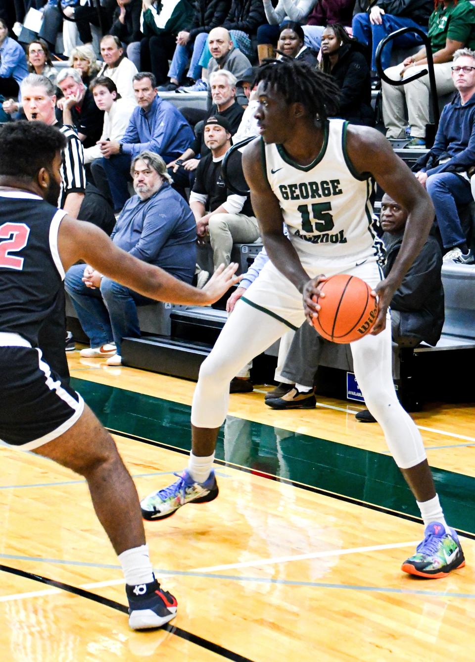 George School senior forward Kachi Nzeh, who has committed to Xavier, prepares to make his move.