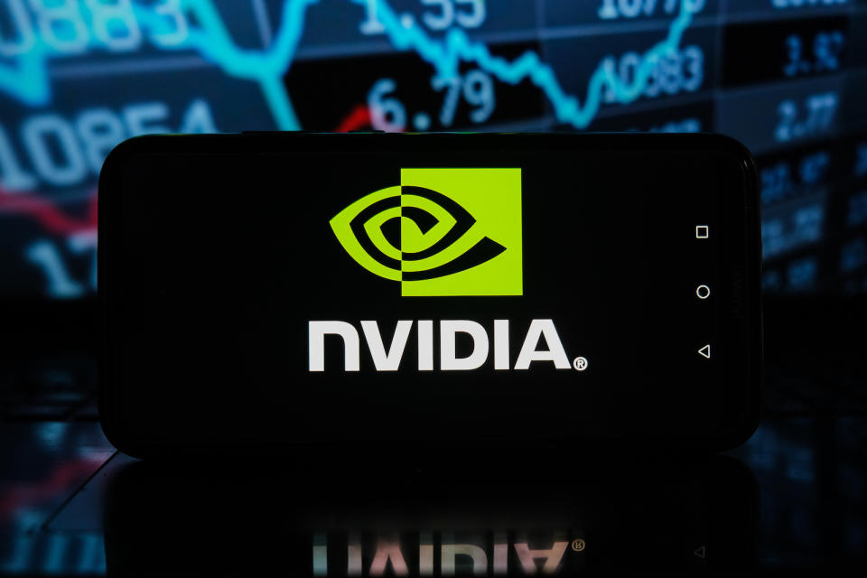 POLAND - 2021/04/08: In this photo illustration a Nvidia logo seen displayed on a smartphone with stock market percentages in the background. (Photo Illustration by Omar Marques/SOPA Images/LightRocket via Getty Images)