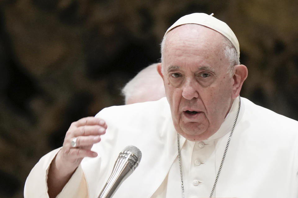 Pope Francis delivers his blessing as he meets with members of the Italian Schools for Peace Network in the Pope Paul VI hall at the Vatican, Monday, Nov. 28, 2022. (AP Photo/Andrew Medichini)