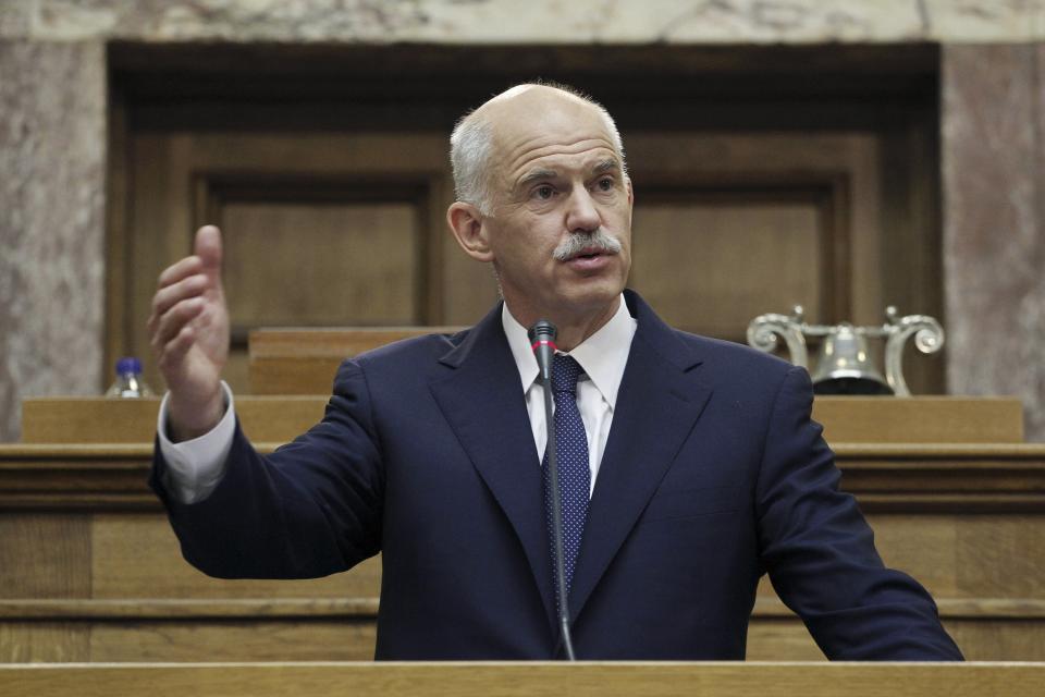 FILE - In this Thursday, Nov. 3, 2011 file photo, Greece's Prime Minister George Papandreou addresses Socialist lawmaker members of parliament in Athens, Greece. Former Greek prime minister George Papandreou says late Wednesday, Oct. 20, 2021, he will seek the leadership of the once-powerful Socialist party founded by his father, the late politician Andreas Papandreou, in an effort to revive its popularity that plummeted during a recent financial crisis. (AP Photo/Petros Giannakouris, File)