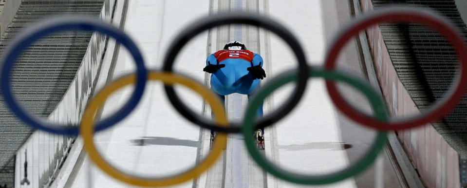 Estonia's Siim-Tanel Sammelselg speeds down the track during a men's ski jumping large hill training session at the 2014 Winter Olympics, Wednesday, Feb. 12, 2014, in Krasnaya Polyana, Russia. (AP Photo/Matthias Schrader)