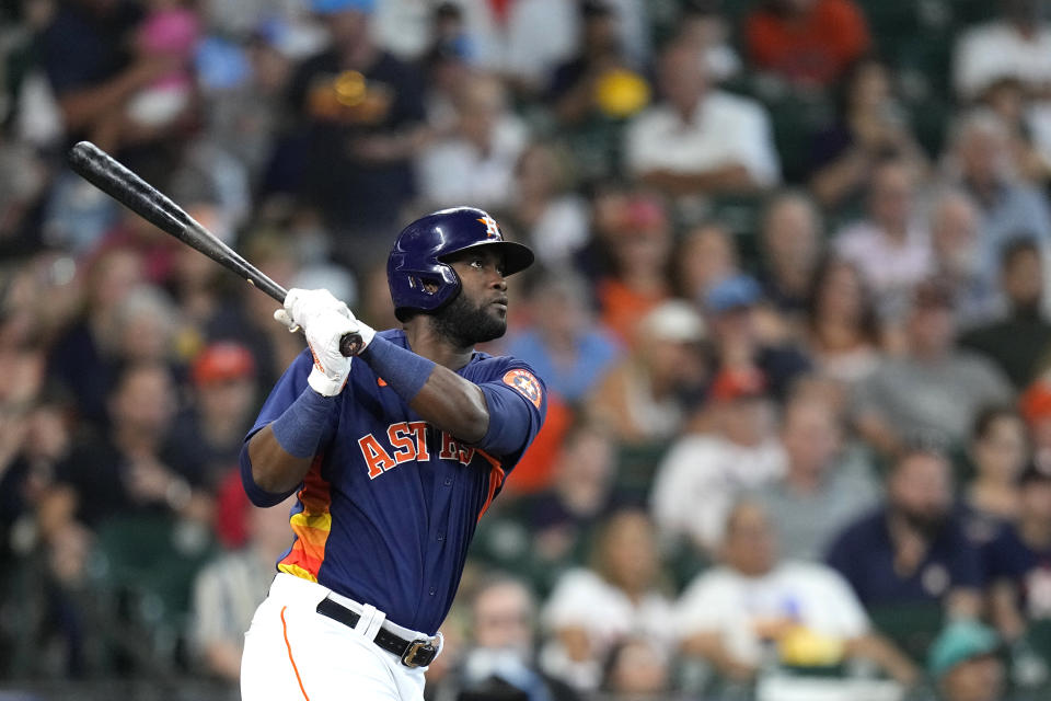 Houston Astros' Yordan Alvarez hits a home run against the Seattle Mariners during the second inning of a baseball game Sunday, Aug. 22, 2021, in Houston. (AP Photo/David J. Phillip)