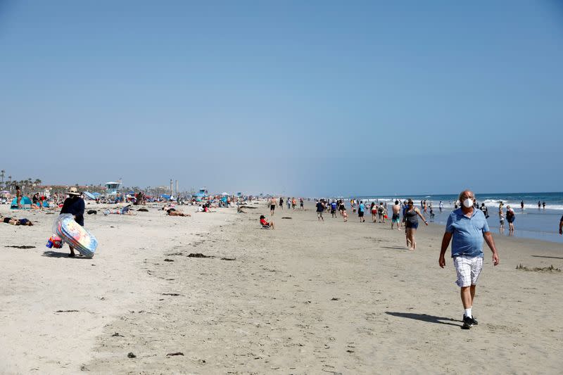 People at the beach on Memorial Day weekend during the outbreak of the coronavirus disease (COVID-19) in Huntington Beach, California