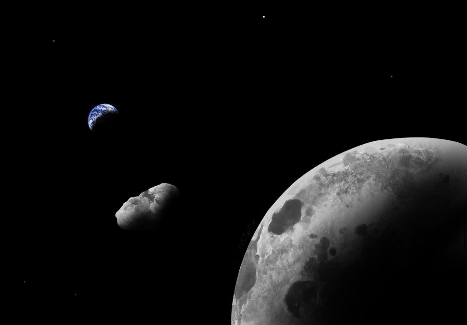A painting represents a large grey asteroid, Kamo`oalewa, floating in space near the moon. The Earth is seen in the background.