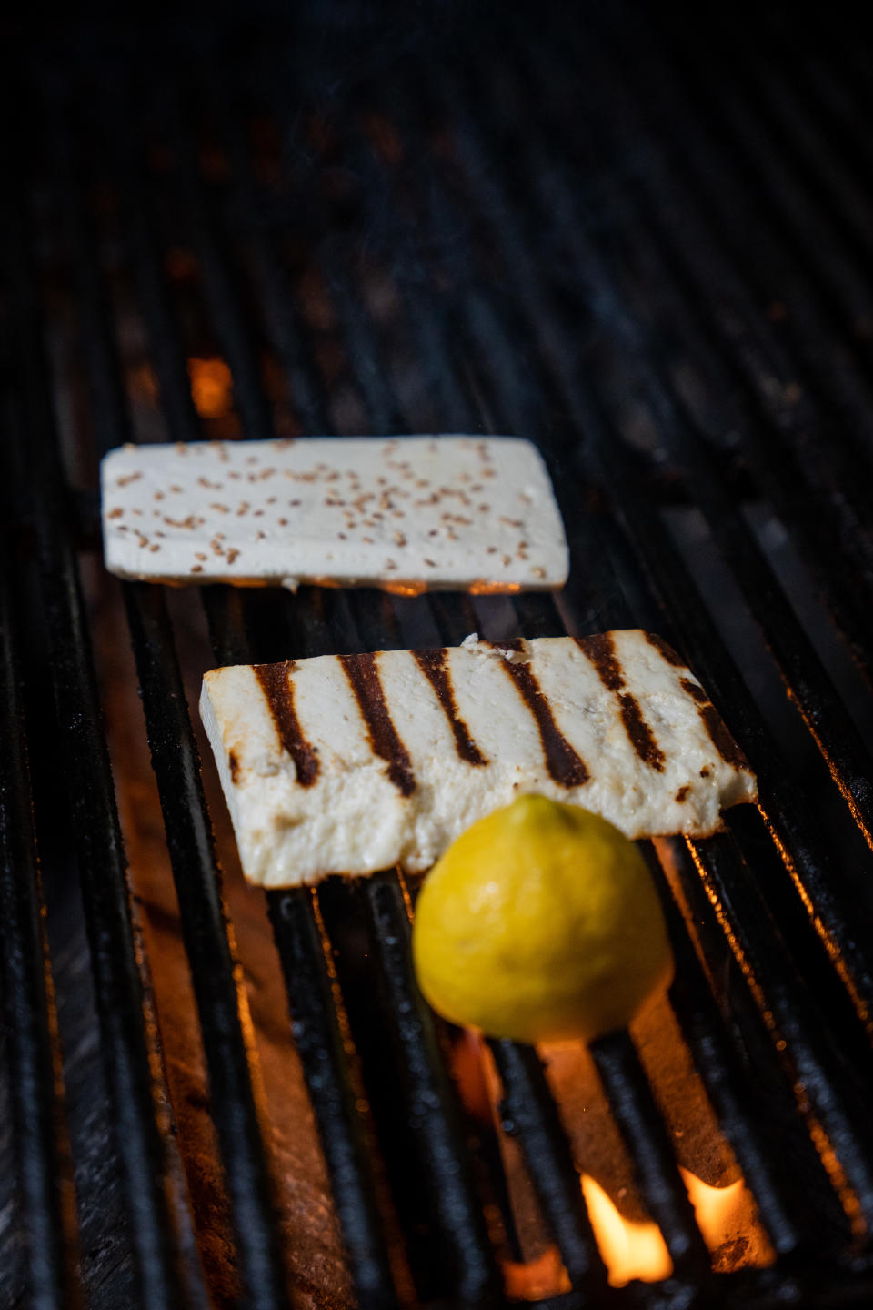 Grilling halloumi on a charcoal grill allows for perfect grill marks on the surface of the cheese. (Photo: Taverna Opa Orlando)