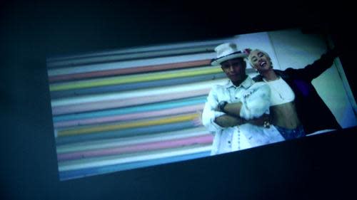 Screen showing Keecker projection of music video