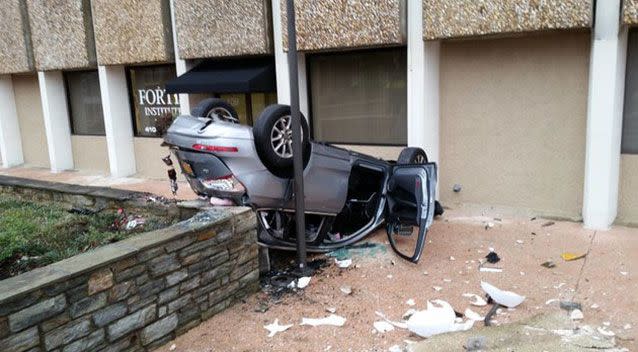 The Audi SUV fell from a four-storey car garage, rolled over and collided with the footpath upside down. Picture: Facebook/Baltimore County Police & Fire