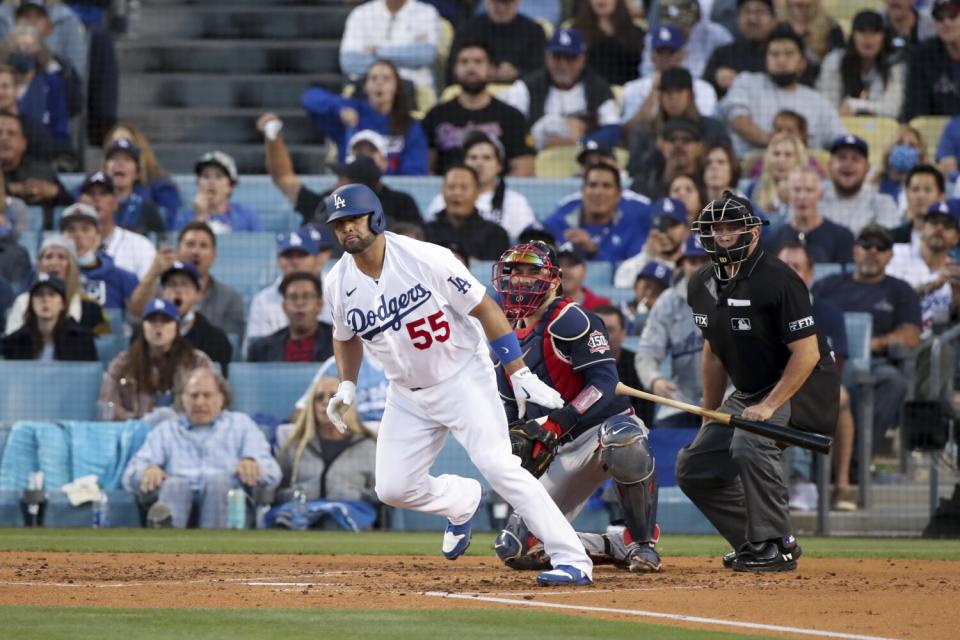 Albert Pujols tosses his bat after hitting a single during the second inning of the NLCS Game 5.