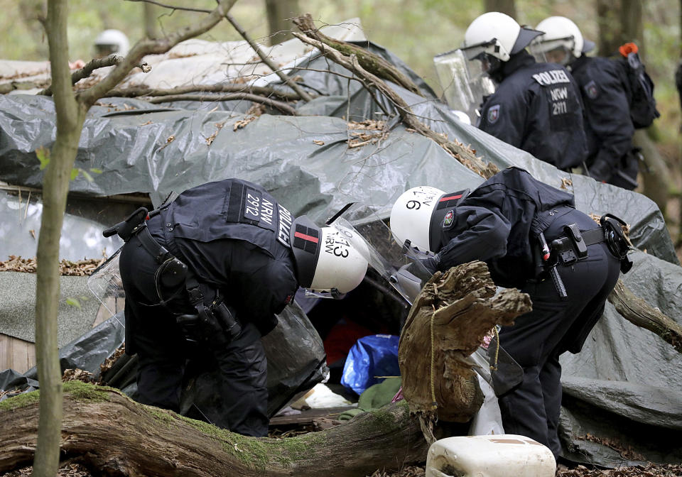 Police enters the 'Hambacher Forest' that protesters are trying to stop from being chopped down for a coal mine in Kerpen, Germany, Wednesday, Sept. 5, 2018. (Oliver Berg/dpa via AP)