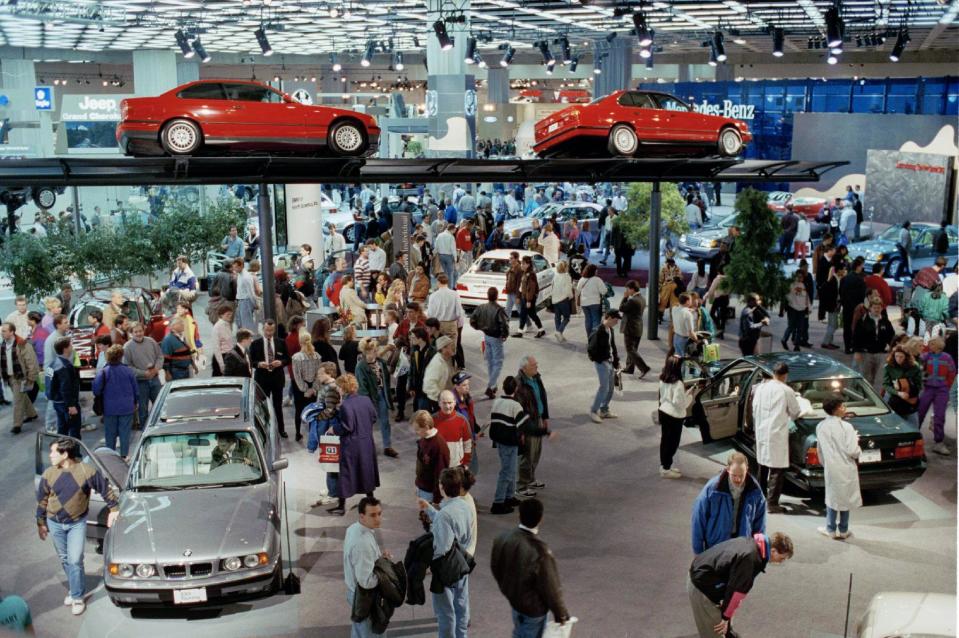 FILE - In this Jan. 9, 1993 file photo, thousands of people visit Cobo Center in Detroit for the North American International Auto Show. (AP Photo/Lennox McLendon)