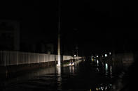 <p>A man walks on a flooded street in the aftermath of Hurricane Maria in San Juan Puerto Rico, late on Sept. 22, 2017. (Photo: Ricardo Arduengo/AFP/Getty Images) </p>