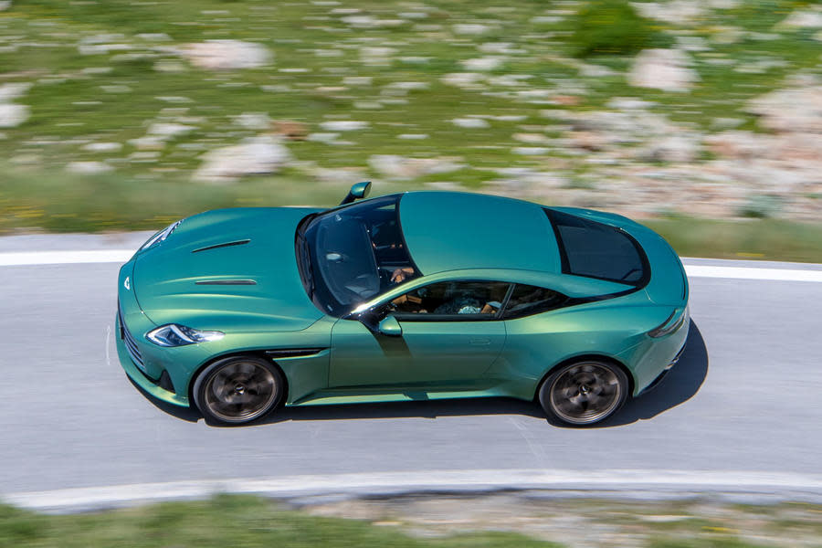 Aston Martin DB12 driving on mountain road – roof