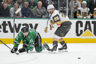 Dallas Stars left wing Jason Robertson (21) is tripped up by Vegas Golden Knights left wing William Carrier (28) during Game 2 of an NHL hockey Stanley Cup first-round playoff series in Dallas, Wednesday, April 24, 2024. (AP Photo/Tony Gutierrez)