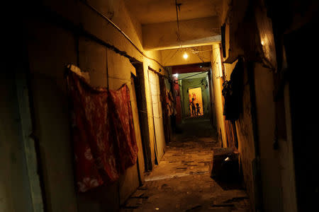 Children are seen in a hallway of the abandoned Prestes Maia textile factory occupied by a homeless movement in downtown Sao Paulo, Brazil, May 12, 2018. REUTERS/Nacho Doce