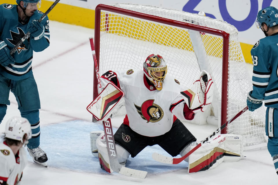 Ottawa Senators goaltender Anton Forsberg (31) makes a save against the San Jose Sharks during the third period of an NHL hockey game in San Jose, Calif., Monday, Nov. 21, 2022. (AP Photo/Godofredo A. Vásquez)