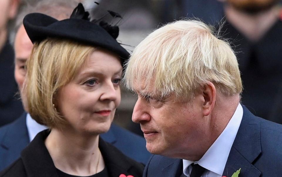 Liz Truss and Boris Johnson are determined to overturn proposals for a ban on new onshore wind farms - Toby Melville/AP