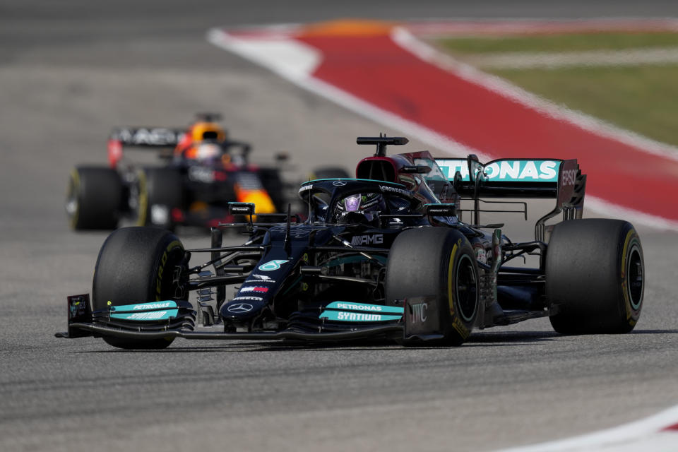 Mercedes driver Lewis Hamilton, of Britain, leads Red Bull driver Max Verstappen, of the Netherlands, during the Formula One U.S. Grand Prix auto race at the Circuit of the Americas, Sunday, Oct. 24, 2021, in Austin, Texas. (AP Photo/Nick Didlick)