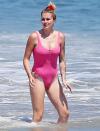 <p>Ireland Baldwin rocks a pink one-piece swimsuit on Monday while catching some rays in Malibu. </p>