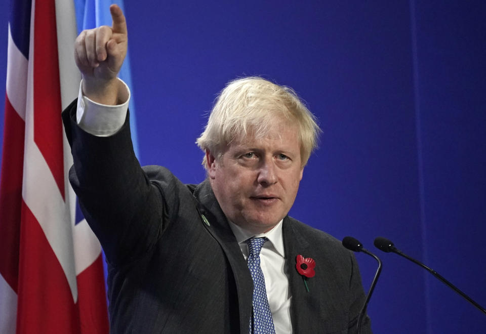 British Prime Minister Boris Johnson gestures as he speaks at the COP26 U.N. Climate Summit, in Glasgow, Scotland, Tuesday, Nov. 2, 2021. The U.N. climate summit in Glasgow gathers leaders from around the world, in Scotland's biggest city, to lay out their vision for addressing the common challenge of global warming. (AP Photo/Alberto Pezzali)