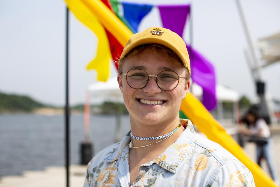 Ames Goldman, of Spring Lake, Mich., poses for a portrait at the Lynne Sherwood Waterfront Stadium in Grand Haven, on Saturday, June 10, 2023. “I've definitely for a few years had a skewed perspective that Grand Haven was just a terrible closed off place,” said Goldman, a 22-year-old transgender male who lives in the community. “But today is resurrecting that love and that hope that I have for Grand Haven.” (AP Photo/Kristen Norman)