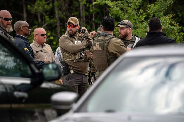 PHOTO: Law enforcement search for the suspect a few miles from the scene where five people, including an 8-year-old child, were killed after a shooting inside a home, April 29, 2023 in Cleveland, Texas. (Go Nakamura/Getty Images)