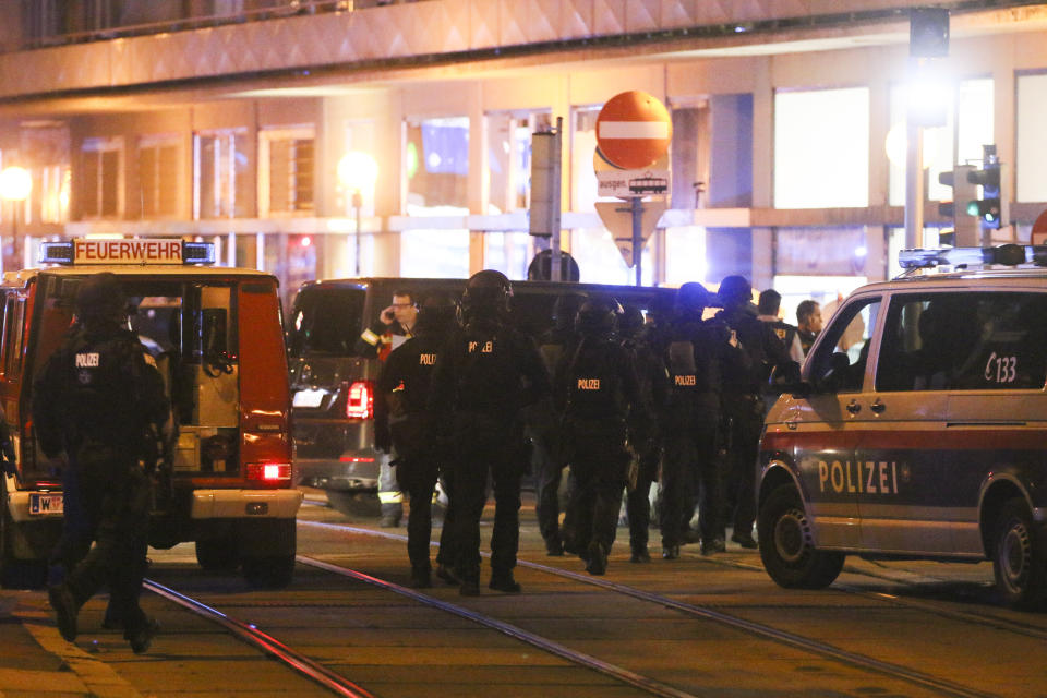 Police officers walk between emergency vehicles at the scene after gunshots were heard, in Vienna, Monday, Nov. 2, 2020. Austrian police say several people have been injured and officers are out in force following gunfire in the capital Vienna. Initial reports that a synagogue was the target of an attack couldn't immediately be confirmed. Austrian news agency APA quoted the country's Interior Ministry saying one attacker has been killed and another could be on the run.(Photo/Ronald Zak)