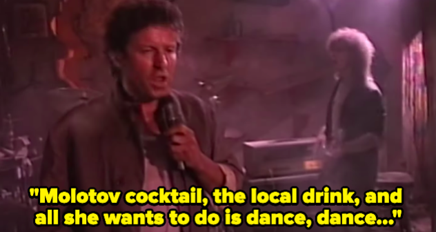 A man singing "Molotov cocktail, the local drink, and all she wants to do is dance"