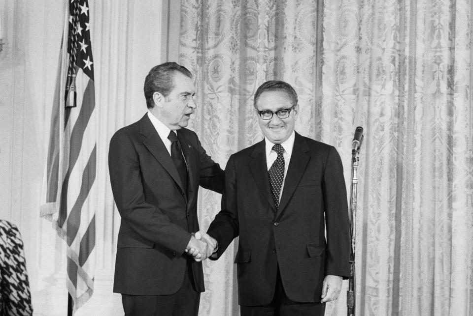 Pres. Nixon congratulates Henry Kissinger after he was sworn in as Secretary of State in a ceremony in the East Room of the White House.