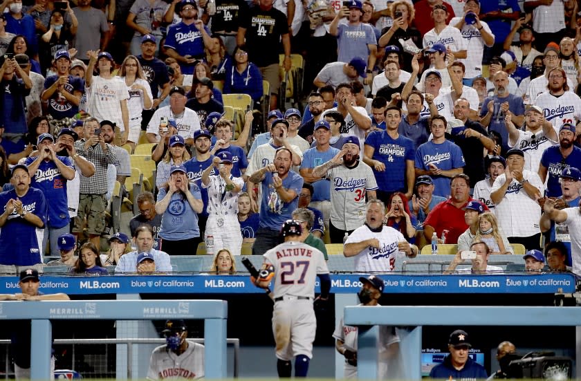 LOS ANGELES, CALIF. - AUG. 3, 2021. Fans boo Astros player Jose Altuve as he heads back to the dugout after striking out against the Dodgers in the fifth inning at Dodger Stadium on Tuesday, Aug. 3, 2021. The Astros cheated by stealing signals during the 2017 World Series against Dodgers. (Luis Sinco / Los Angeles Times)