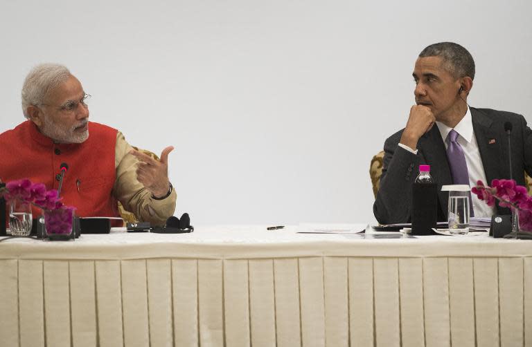 Indian Prime Minister Narendra Modi (left) and US President Barack Obama talk during the India-US Business Summit in New Delhi, on January 26, 2015