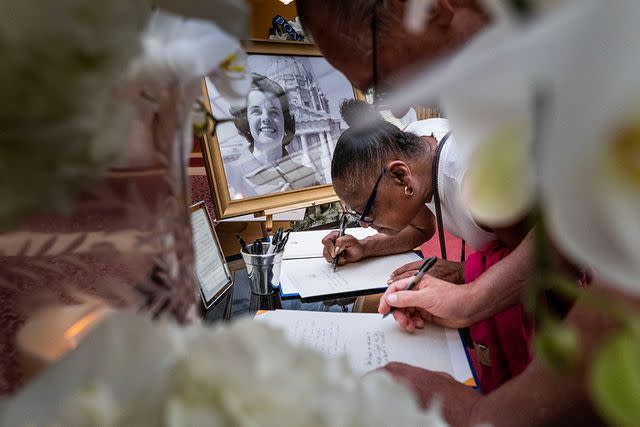 A mourner leaves a note addressed to late Sen. Dianne Feinstein at San Francisco City Hall on Oct. 4, 2023