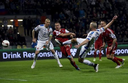 Adam Nemec (2nd R) of Slovakia scores a goal against Luxembourg during their Euro 2016 qualification soccer match at the MSK stadium in Zilina March 27, 2015. REUTERS/Radovan Stoklasa