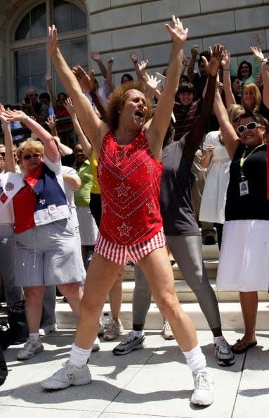 2008: Fitness advocate Richard Simmons (center) dances with fans during a rally on Capitol Hill on July 24, 2008, in Washington, D.C. Simmons was on the Hill for a hearing and a rally to promote the benefits of physical and health education for children.